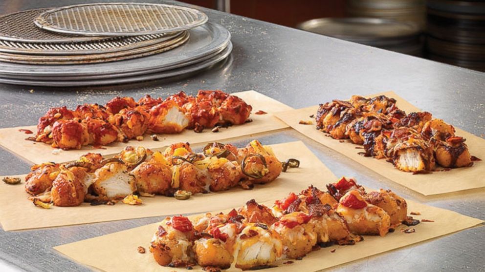 Dominos is covering fried chicken with traditional pie toppings for a new take on "pizza."