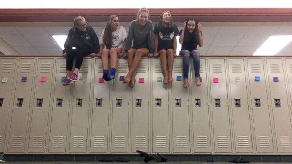 Anna Aronson, Erica English, Michelle Crispin and Ellie Uematsu -- sophomores at Mason High School in Mason, Ohio, surprised around 3,600 of their fellow schoolmates with positive message sticky notes on their lockers on Aug. 30, 2016, to uplift the school's spirit following the recent tragic death of a student, according to the Mason City Schools' public information officer. 
