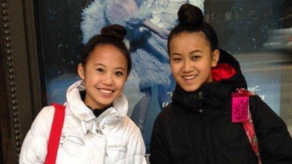 Nora Ryan, left and K.J. Jacoby, both 13, were adopted by different families on the same day in China.