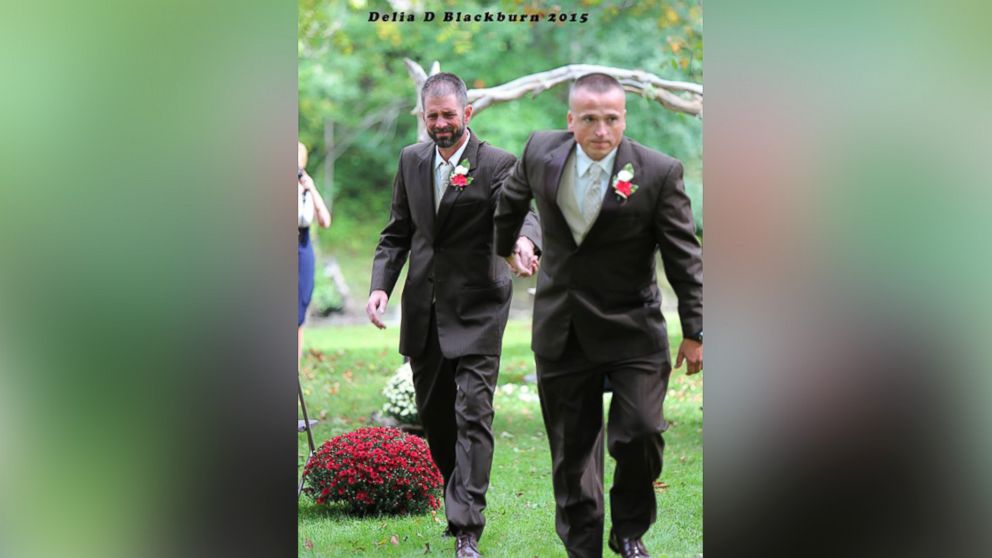 Brittany Peck's wedding photos have gone viral after her father grabbed her stepfather so they could both walk her down the aisle.
