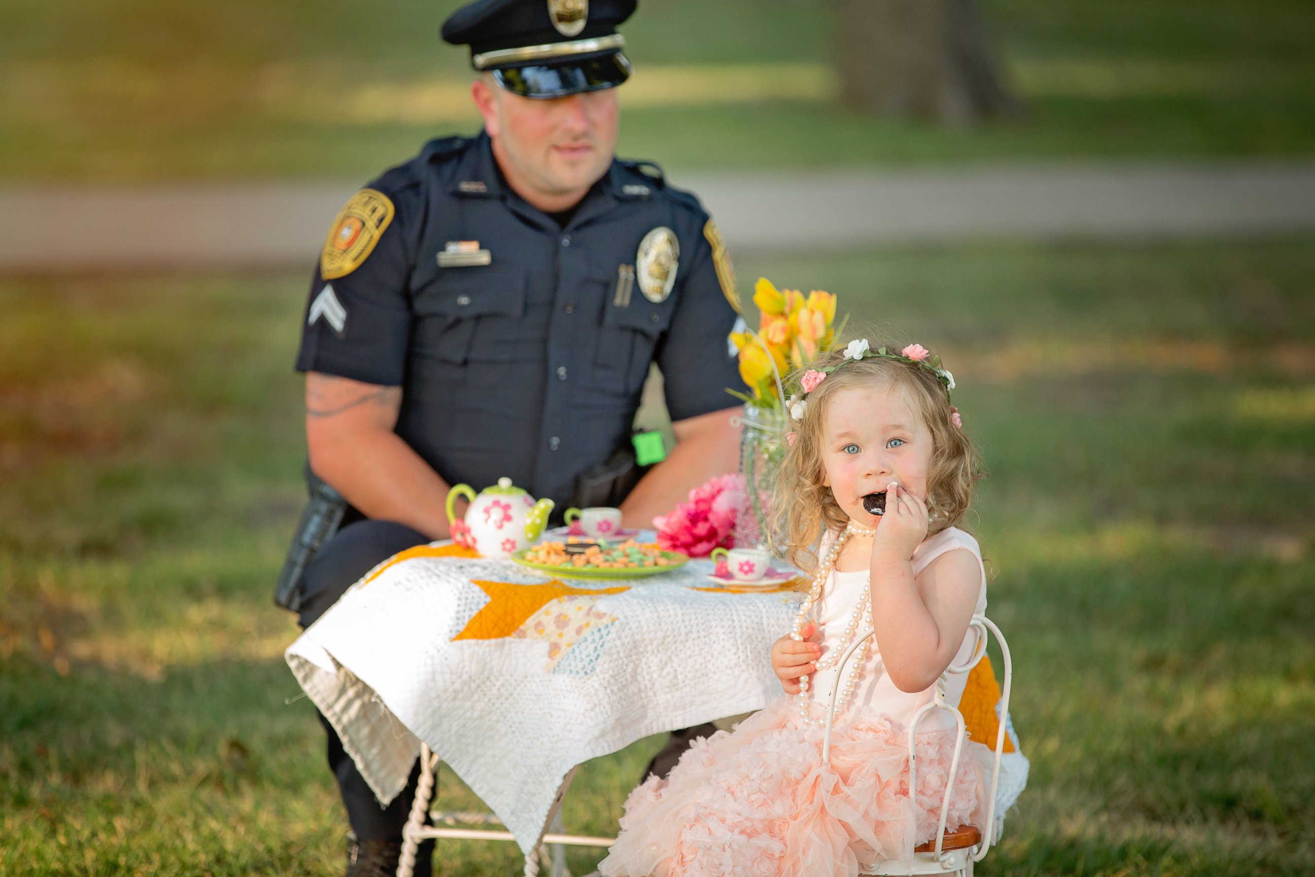 PHOTO: On July 26, 2015, Bexley, 2, the daughter of Tammy Norvell of Rowlett, Texas, was saved by Officer Patrick Ray after being choked on a penny. One year later, the pair had a tea party photo shoot. 