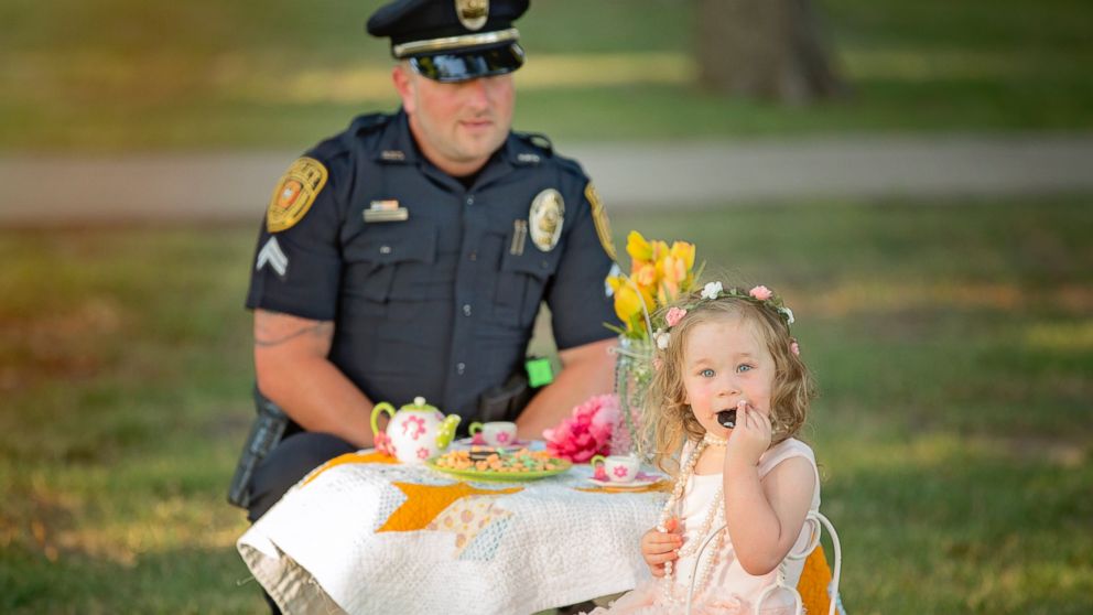 PHOTO: On July 26, 2015, Bexley, 2, the daughter of Tammy Norvell of Rowlett, Texas, was saved by Officer Patrick Ray after being choked on a penny. One year later, the pair had a tea party photo shoot. 