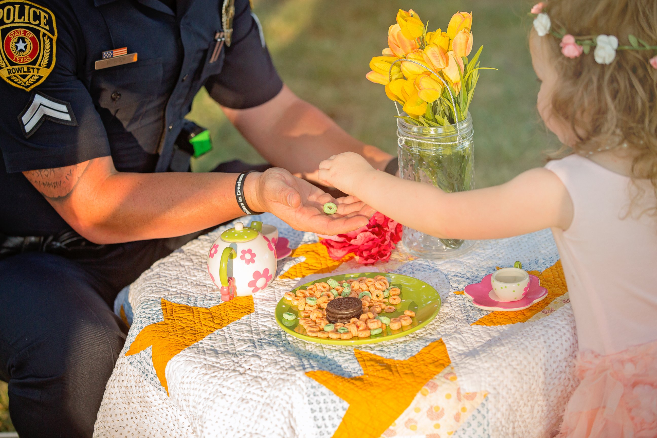 PHOTO: On July 26, 2015, Bexley, 2, the daughter of Tammy Norvell of Rowlett, Texas, was saved by Officer Patrick Ray after being choked on a penny. One year later, the pair had a tea party photo shoot. 