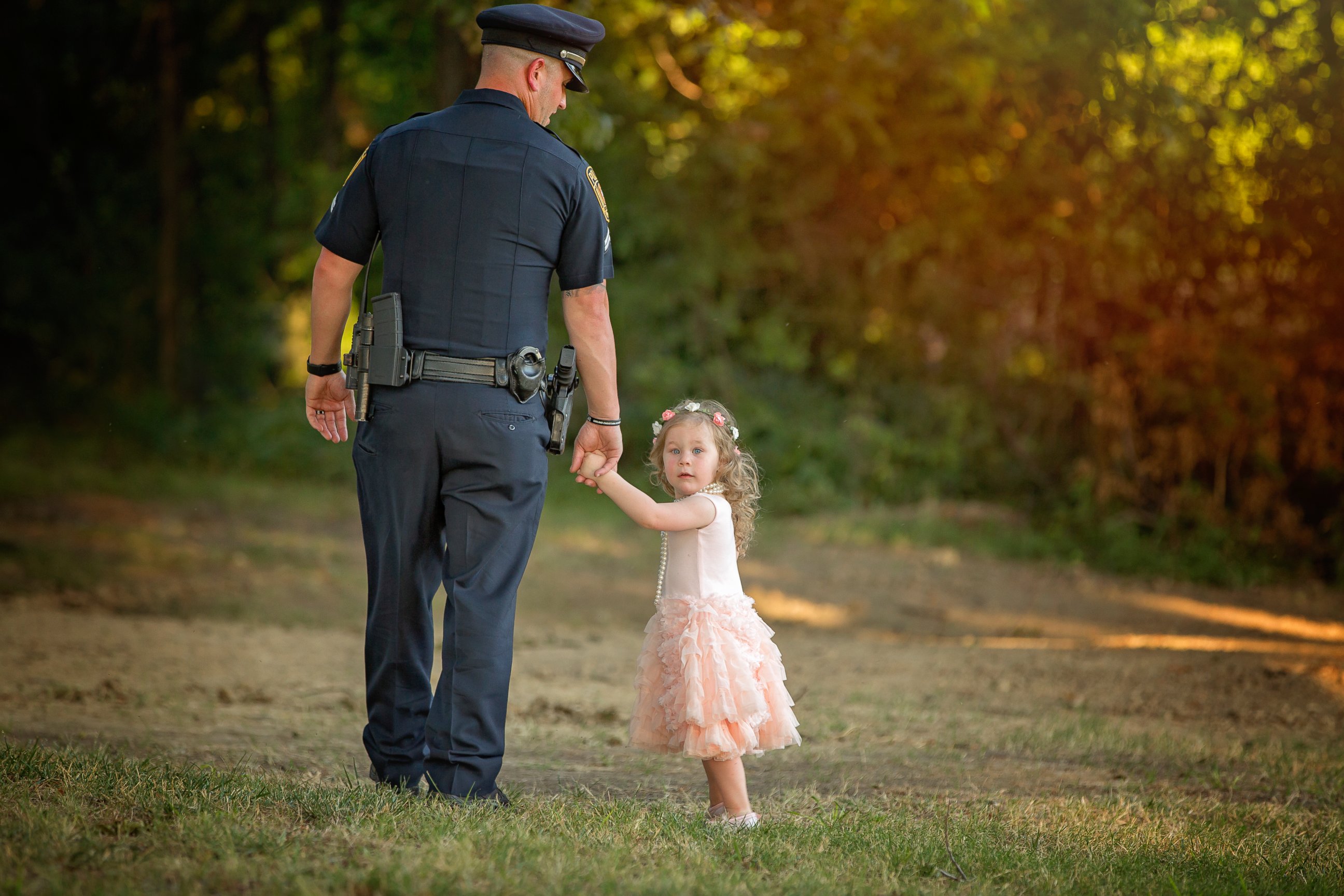 PHOTO: On July 26, 2015, Bexley, 2, the daughter of Tammy Norvell of Rowlett, Texas, was saved by Officer Patrick Ray after being choked on a penny. One year later, the pair had a tea party photo shoot. 