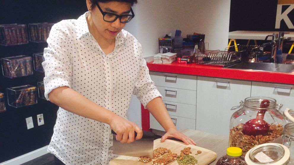 Tina Yang, KIND's food scientist, at work in the kitchen.