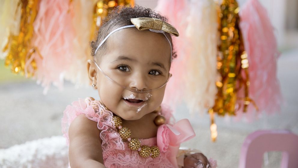 Ajshay James' daughter Harper, born at 23 weeks old, celebrates first birthday with glam photo shoot.