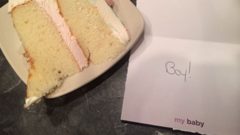 PHOTO: The "boy" card next to the cake's pink "girl" icing.
