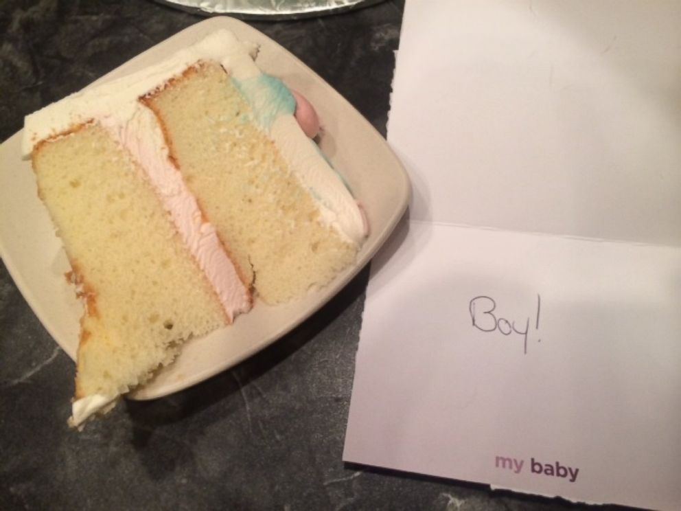 PHOTO: The "boy" card next to the cake's pink "girl" icing.