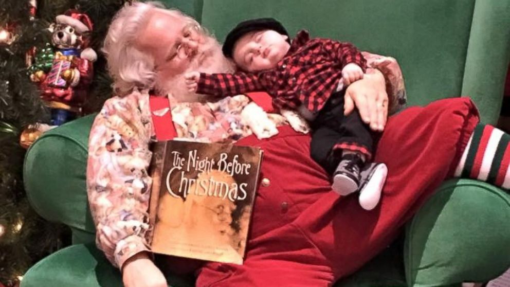 Zeke Walters, 6 months, fell asleep while waiting in line to take photos with Santa on November 25.