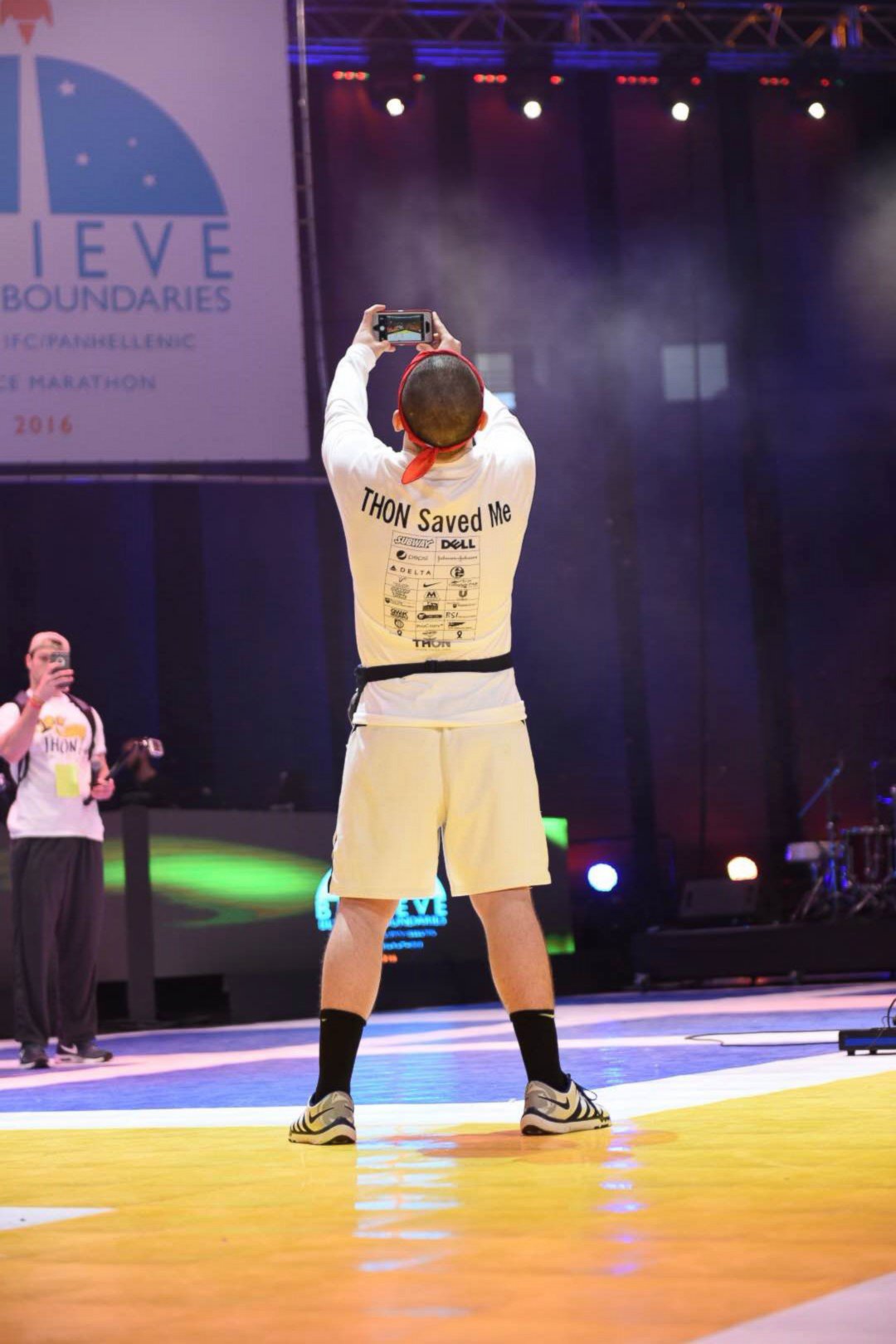 PHOTO: Brady Lucas snaps a photo at Penn State University's THON, which raises money for pediatric cancer patients.