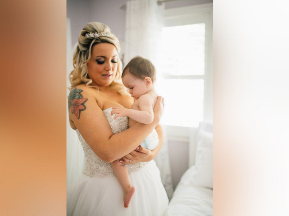 PHOTO: Christina Torino-Benton's viral photo of her breastfeeding her daughter, Gemma, during her wedding ceremony, has gone viral. 