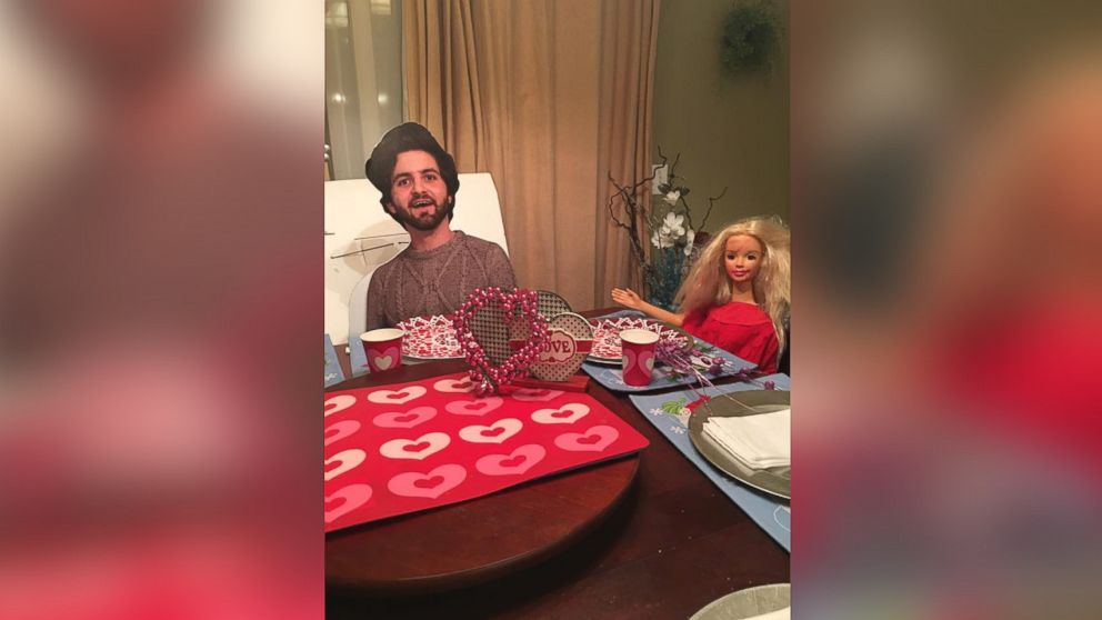 A Tennessee mom is posing her son's cardboard cutout in funny photos while he studies abroad in England.