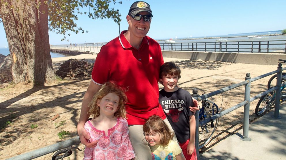 Chris Bernholdt, the dad behind the blog DadNCharge, thinks it's time to ban the play date. He is pictured here with his three kids.