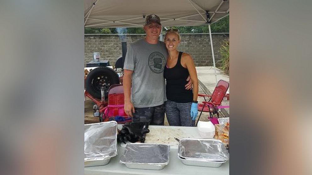 Christian and Amanda Dornhorst of Port Allen, Louisiana cooked barbecue food for the flood victims, military and police over the course of two days at Celtic Media Centre in Baton Rouge, on August 15 and 16. 
