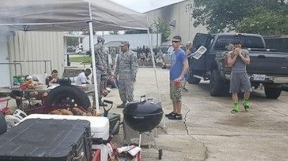 PHOTO: Christian and Amanda Dornhorst of Port Allen, Louisiana cooked barbecue food for the flood victims, military and police over the course of two days at Celtic Media Centre in Baton Rouge, on August 15 and 16. 