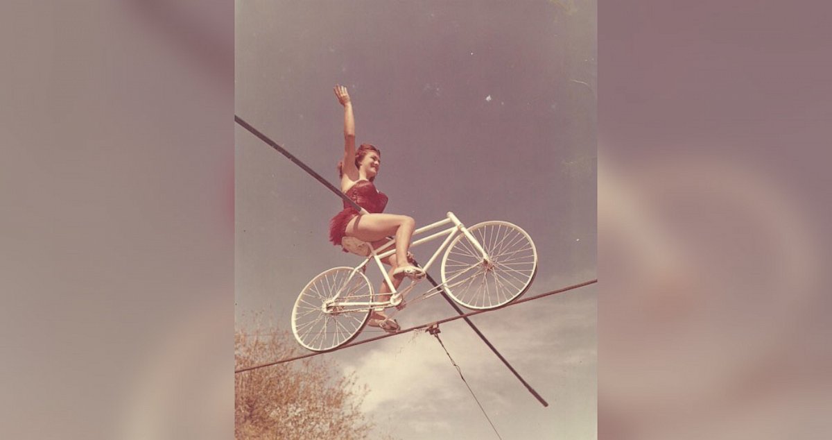 PHOTO: Carla seen bicycling on a tightrope.
