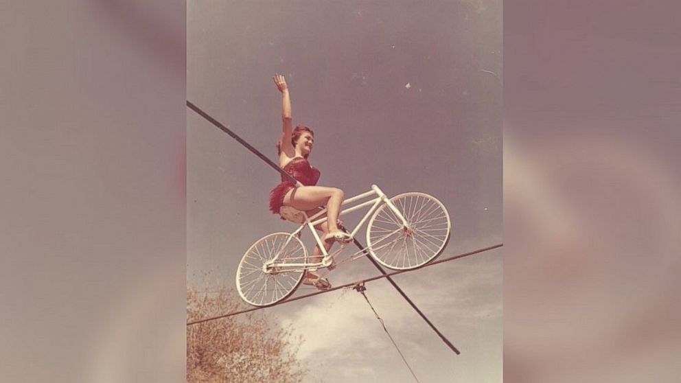 PHOTO: Carla seen bicycling on a tightrope.
