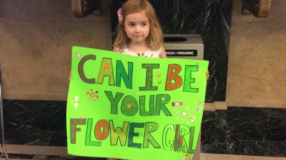 The four-year-old held a sign advertising her services at City Hall on Friday.