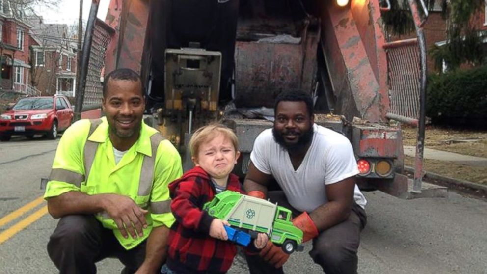 Ollie Kroner posted this photo to Facebook, March 13, 2015, with the caption, "Quincy's been waiting all week to show the garbage men his garbage truck. But, in the moment, he was overwhelmed in the presence of his heroes."