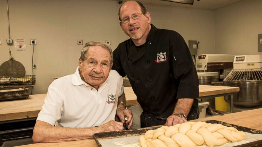 PHOTO: Sigmund, left, passed along the duties of the bakery to his son, Bobby, right.