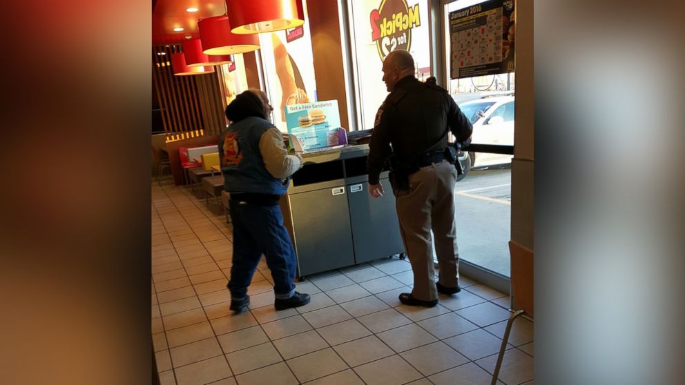 Alex Fischbach, 20, snapped a photo of Sergeant George Depuy buying a homeless man lunch at a McDonald's in Morrison, IL.