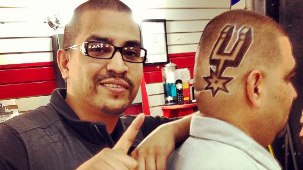 Joe Barajas, known as Joe the Barber, shows off one of his famous Spurs haircuts. 
