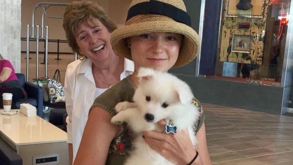 Lacey Dietz seen with her new dog, Casper, on August 13 at Tampa International Airport, along with her grandmother, Billy Meehan.