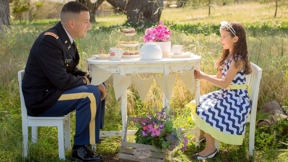 PHOTO: Professional photographer Vanessa Hicks captures military personnel with their children in her popular "Military Tea Time Mini Sessions."