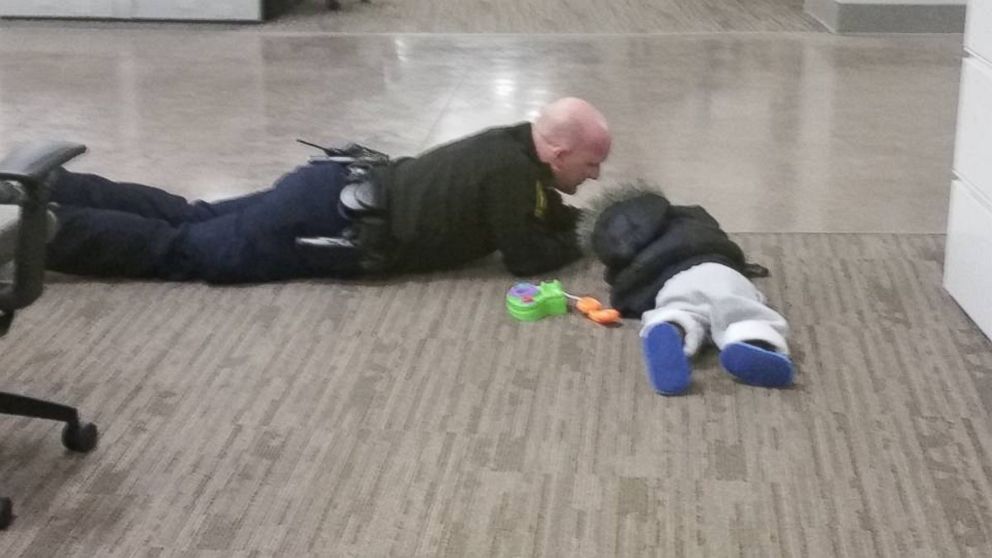Officer Will Nastold was captured comforting a toddler on Feb. 1 at the Cincinnati Police Department. 