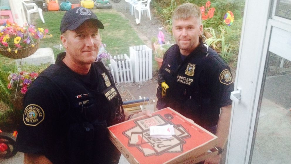 Steve Huckins snapped a photo of two Portland police officers delivering his pizza after the driver was in accident.