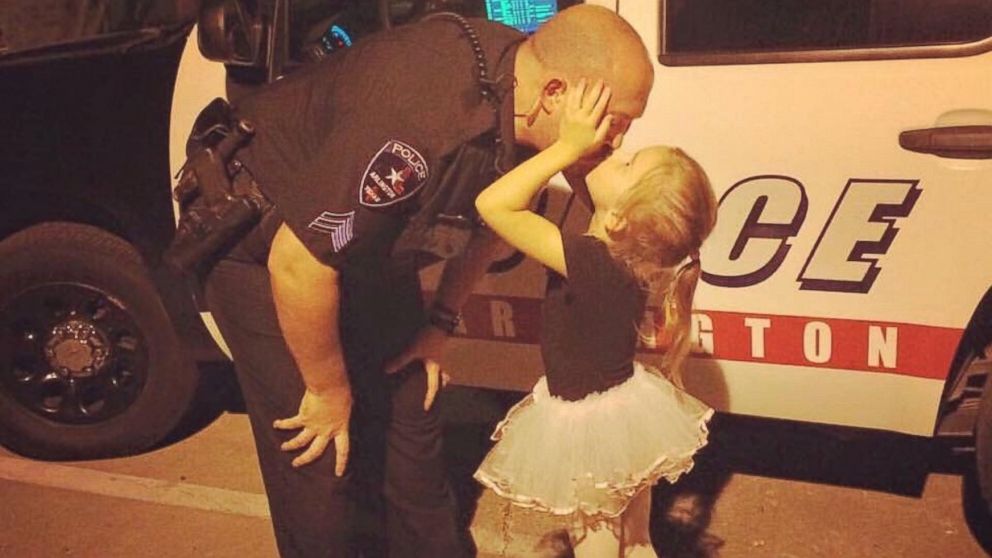 PHOTO:A photo of Sergeant J. McRay kissing his little girl has gone viral online. 
