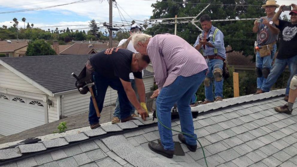 PHOTO: Richard Dubiel, 75, hammered in the final nail after strangers volunteered to repair his roof. 