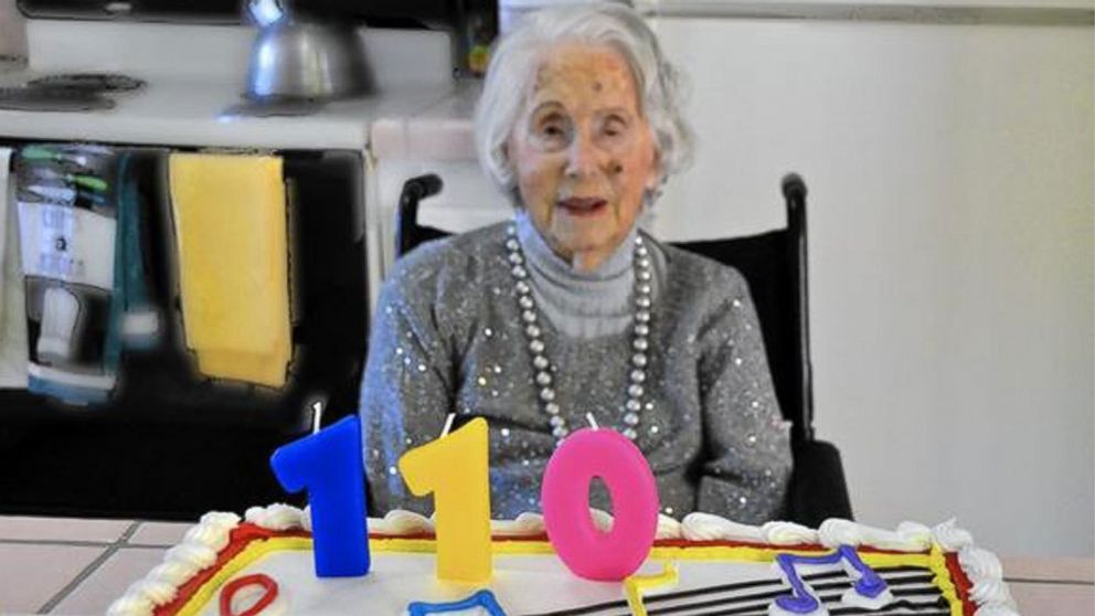 PHOTO: Sally Mitchell admires her cake as she celebrates her 110th birthday on Nov. 25, 2014. 