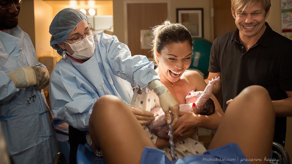 Kim Overton's joy at seeing the birth of her son Oliver via surrogate is captured here
