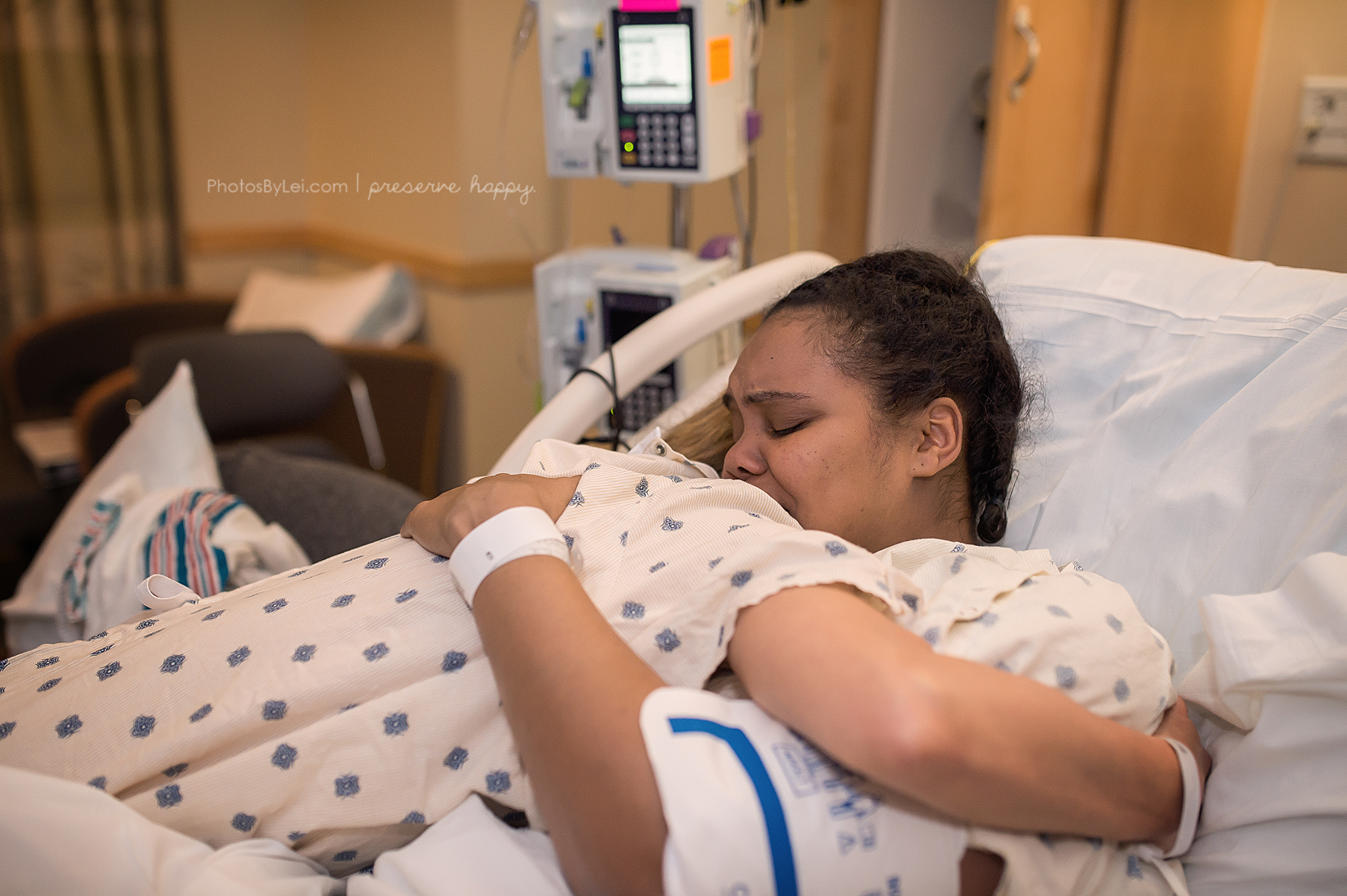 PHOTO: Kim Overton embraces her surrogate after the birth of her son Oliver.