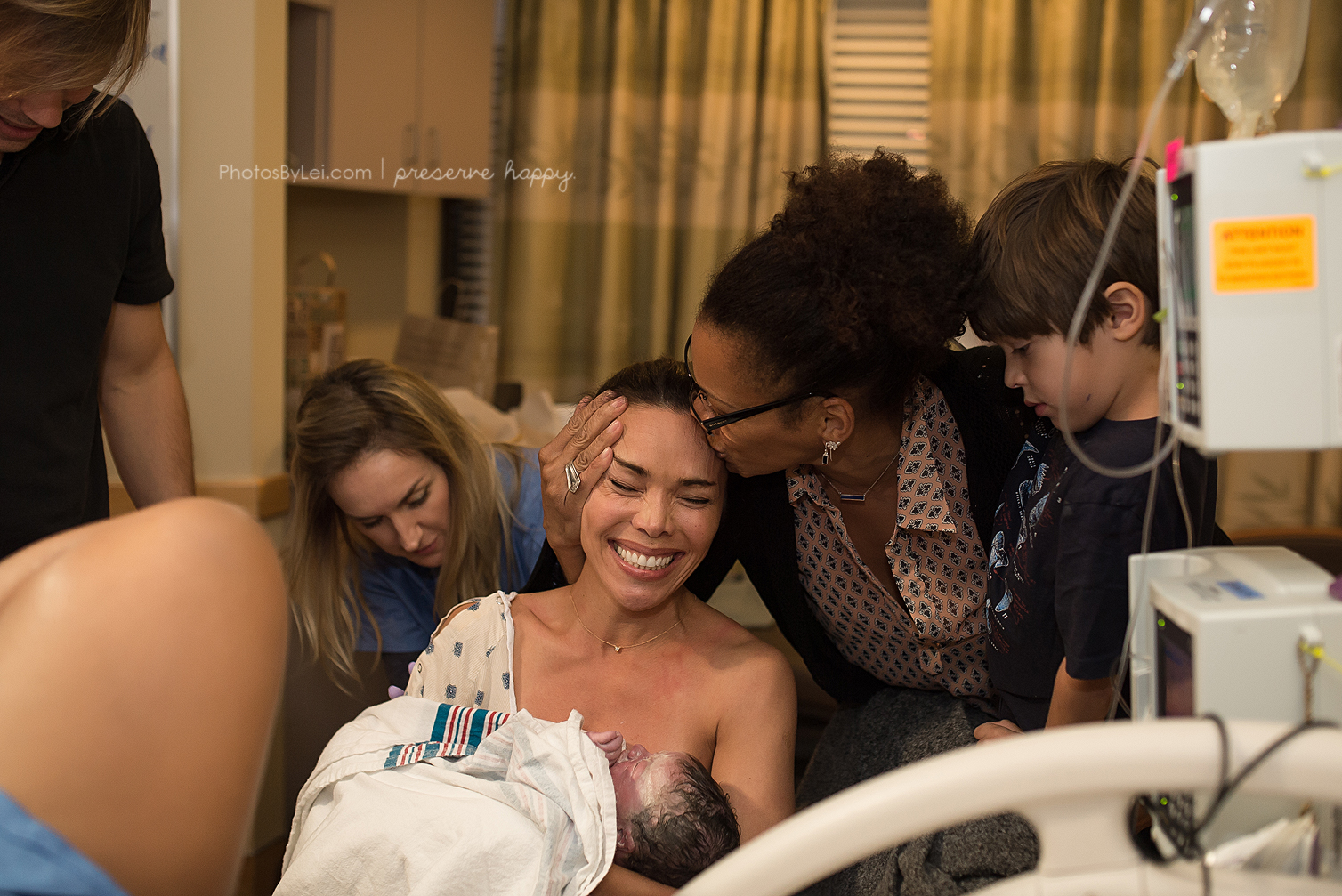 PHOTO: Kim Overton's joy at seeing the birth of her son Oliver via surrogate is captured here.