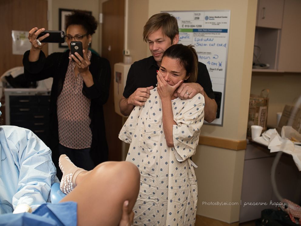 PHOTO: Kim Overton's joy at seeing the birth of her son Oliver via surrogate is captured here.