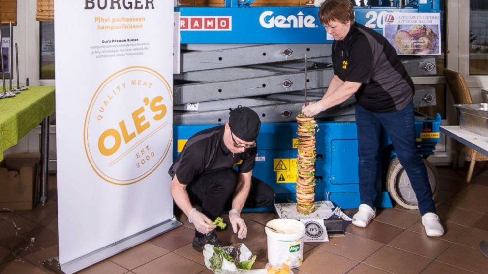 PHOTO: Workers get started stacking what a cafe in Finland claims is the world's tallest burger.
