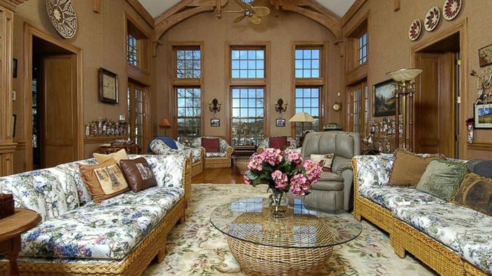 PHOTO: Donald Trump's former Connecticut mansion features a massive living room with an arched-ceiling and wood details.