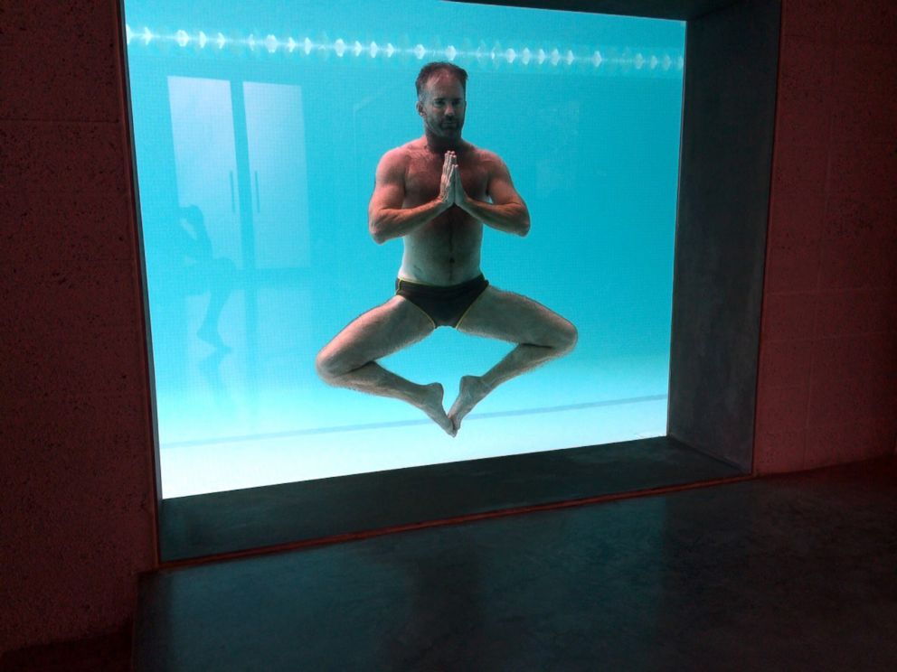 PHOTO: Fitness expert Scott Cole performs underwater yoga poses, 2014.