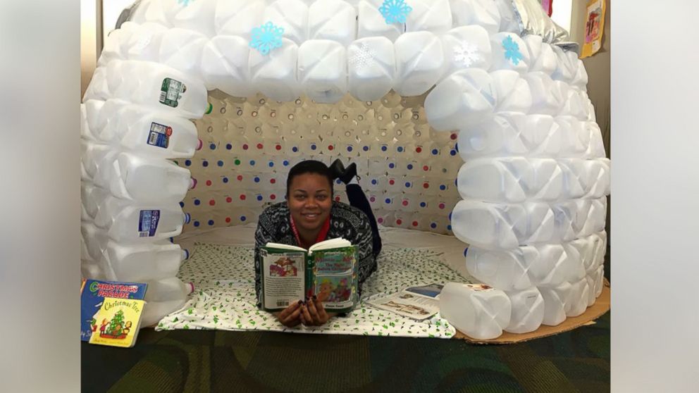 PHOTO: Brittney Ash, of the Virginia Beach Public Library, used recycled milk cartons to create a display, encouraging people to read.