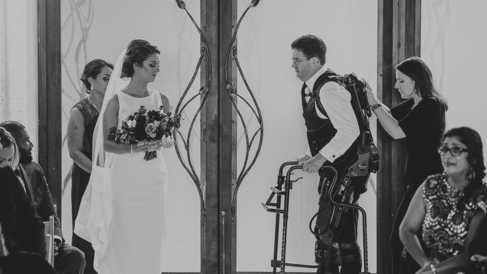 PHOTO: Scott Holland didn't let his multiple sclerosis stop him from walking his daughter, Elise Holland, down the aisle. He surprised her on her wedding day by using an exoskeleton to help him walk. 