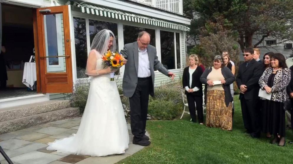 PHOTO: Ralph Duquette surprised his daughter Heather by standing up from his wheelchair and walking her down the aisle at her wedding in Maine.
