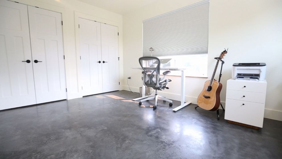 PHOTO: Joshua Fields Millburn's desk and guitar are pictured here in a room at his minimalist Missoula, Mont., home. 