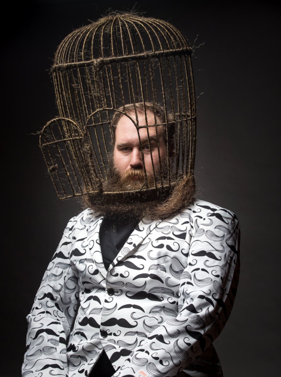 PHOTO: Man Turns Lavish Beard into Enormous Bird Cage