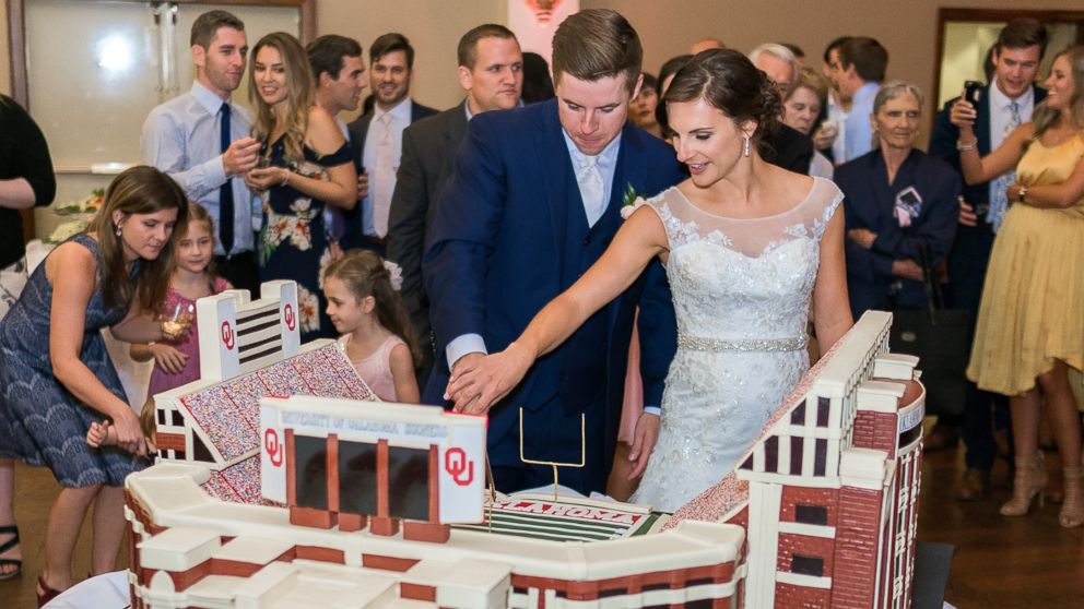 PHOTO: Bride Caddie Protor and groom Samuel Cox cut the cake on their wedding day. 