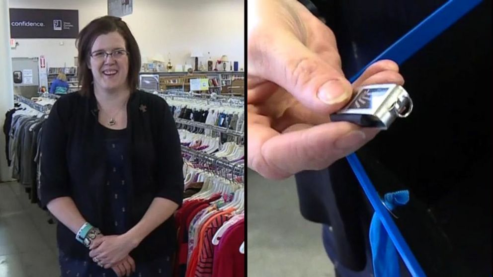 Caption: Molly Szymkowski, of Waterloo, Wisconsin, found a flash drive containing family photos inside a donated box at a Goodwill store.