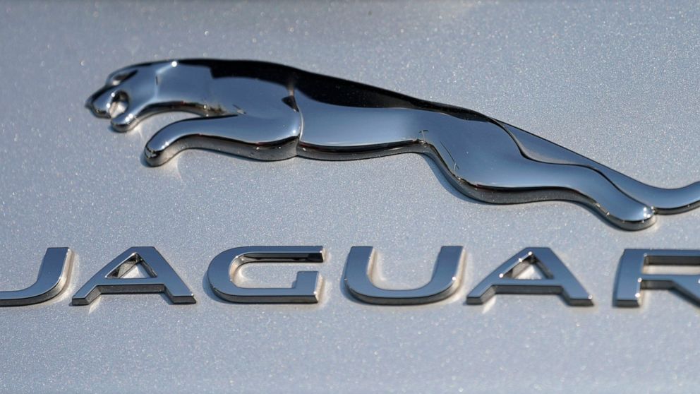 FILE - In this file photo dated Sunday, Sept. 6, 2020, the Jaguar car company logo shines off the deck of an I-Pace electric vehicle at a Jaguar dealership, in Littleton, USA. Struggling luxury car brand Jaguar will be fully electric by 2025, the Bri
