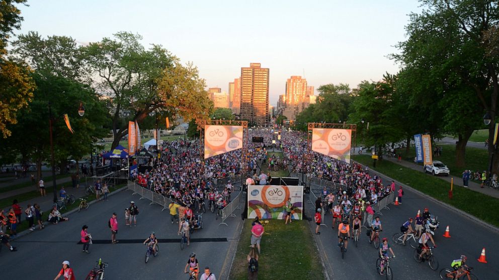 Cyclists get underway in Tour la Nuit, the annual Montreal bicycle festival's night ride, June 3, 2016. This year, on May 31, the crowd of some 10,000 will bicycle into and around Montreal's Olympic Stadium as part of the night tour. Montreal is a ho