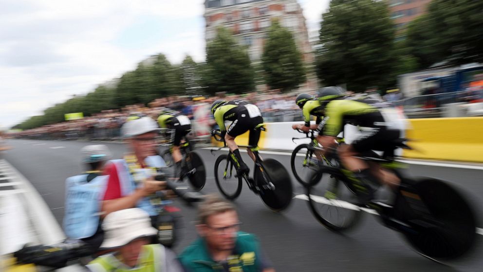 Mitchelton Scott team strains during the second stage of the Tour de France cycling race, a team time trial over 27.6 kilometers (17 miles) with start and finish in Brussels, Belgium, Sunday, July 7, 2019. (AP Photo/Thibault Camus)